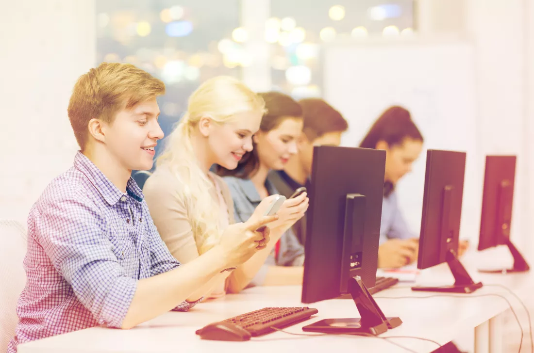 education-techology-internet-concept-group-smiling-students-with-computer-monitor-smartphones