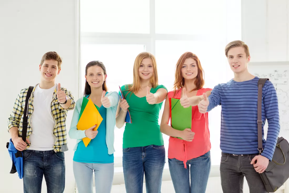education-school-concept-group-smiling-students-with-bags-folders-school-showing-thumbs-up