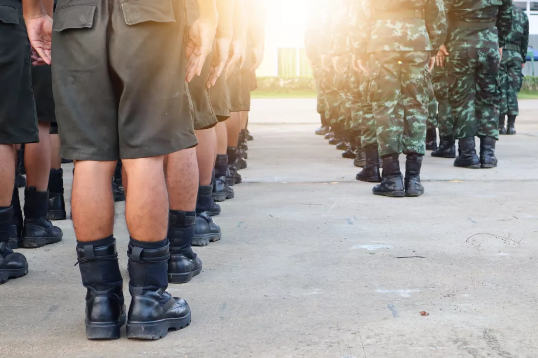 low-section-army-soldiers-standing-road